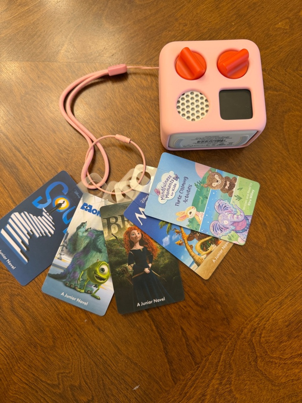 Yoto with case, charger, ring to hold cards, and 5 Yoto cards